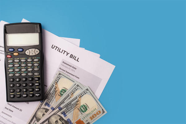 Calculator and utility bill,