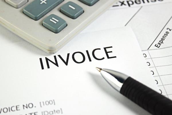 Calculator and paper invoice