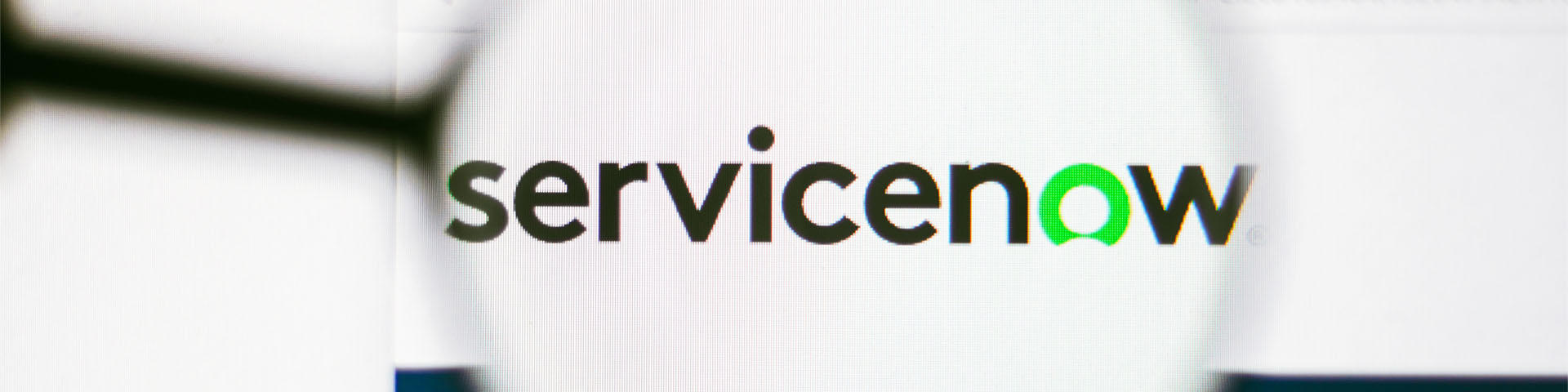 June 13, 2022, Brazil In this photo illustration, the homepage of the ServiceNow, Inc. website seen on a computer screen through a magnifying glass.